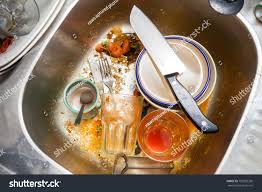 dirty kitchen sink after having meal