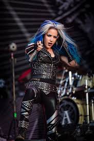 Her vocal style includes both growling and clean vocals (singing). Alissa White Gluz Wikipedia