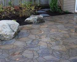 Flagstone Patio Pavers This flagstone patio design features natural stone pavers, a stacked stone fireplace and rustic wooden. flagstone patio pavers