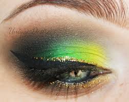 Black And Yellow Eyeshadow Looks Green Yellow Gold Glitter Black Eyeliner Intense Makeup Hair Makeup Makeup Looks