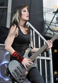 Chuck a mask on and look after each other. Photos And Pictures 21 May 2011 Columbus Ohio Bassist Emma Anzai Of The Australian Rock Band Sick Puppies Performs As Part Of The Rock On The Range Festival Held