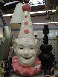 Creepy clown lamp with glowing eyes in Newberg or Goodwill