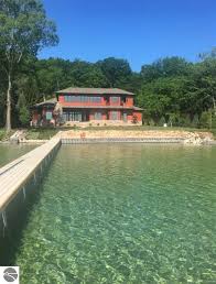 Nature reserves stocked with wildlife, a lengthy art trail, and vineyards await you. 9243 Sw Torch Lake Dr Rapid City Mi 49676 Mls 1883284