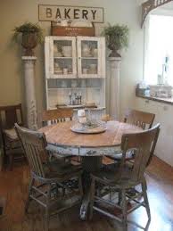 Gather round in rustically refined style with the dining table. Farmhouse Dining Old Round Table Chairs Love The Chippy Pillar And The Cupboard Myhomelookbook Farmhouse Dining Home Rustic Kitchen Tables