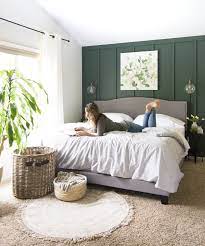 Soft grays, sleek lines, black metal accents, and neutral abstract art with plenty of throw pillows and soft blankets create a haven in the master bedroom. How To Install Board And Batten As An Accent Wall Green Master Bedroom Master Bedrooms Decor Bedroom Interior