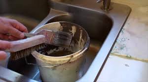 a paint brush in a sink (latex paint