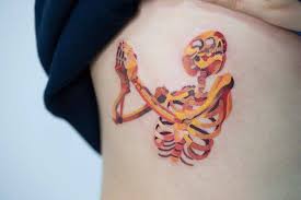 A great little design that is interesting because it's like a little storm cloud. Watercolor Skeleton Tattoo On The Right Ribcage