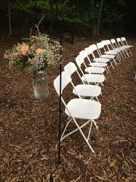 White Chairs With A Shepherd S Hook And Gorgeous Flowers For The Wedding Ceremony Set Up Event Rental White Chair Rental Company