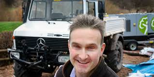 An apple farmer and his Unimog braving the floods.