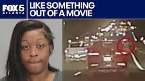 Hanging out of stolen car, shooting at officers