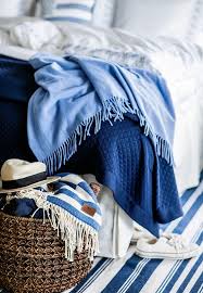 In the image above, the bedroom is defined by the stark contrast between white and navy blue splendidly enhanced by light and a small pattern on the bed cover, despite the small interior, the high contrast unloads the dark navy color easily in a splendid ambiance. The Decorating Blues In My Own Style