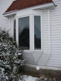 From the outside bay windows add a traditional charm to a home that can make for a real selling point, while inside they help to make a room more spacious and comfortable. Windows Replacement Window Project In Austin Mn Exterior Before Bay Window Replacement