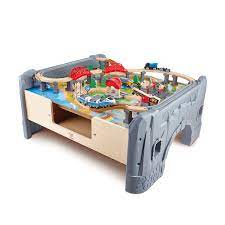 Hape e3766 70 piece railway train table and set toy with battery powered locomotive with removable playmat surface and storage for kids 3 years and up. 12 Best Train Tables For Kids In 2021 Wooden Train Tables Sets
