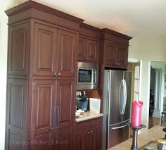 We continually strive to incorporate the finest materials and construction techniques available. The Contrasting Cherry And Black Jay Rambo Kitchen Cabinets Give A Sophisticated Backdrop To An Arra Traditional Kitchen Design Kitchen Design Kitchen Cabinets