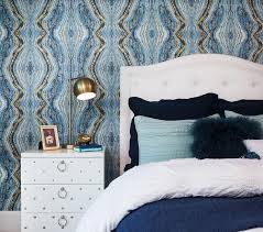 Your gaze is automatically drawn to the wallpaper: White And Blue Bedroom With White Lacquered Studded Nightstand Contemporary Bedroom