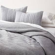 A bed with space to relax and also to store your things. Bed Linens And Bedding Sets Crate And Barrel