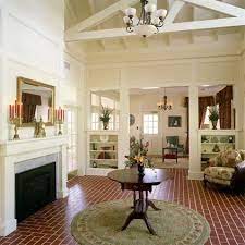 A large great room featuring a stunning vaulted ceiling and classy hardwood flooring. Half Wall Partition Room Divider Bookcase Living Room Divider Living Room Remodel