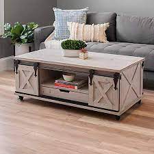 Darker wood trims offer contrast and textured detail. Gray Finished Farmhouse Sliding Door Coffee Table Kirklands Door Coffee Tables Coffee Table Farmhouse Coffee Table