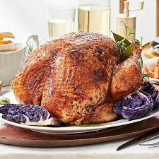 Golden roasted Christmas turkey with herbs and lemon slices.”