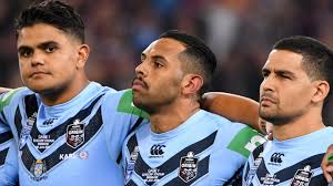 Indigenous players on both sides of the origin divide opted not to sing the national anthem. Nrl All Stars National Anthem Boycott Latrell Mitchell Josh Addo Carr Cody Walker Anthony Mundine Colin Kaepernick Advance Australia Fair The Courier Mail
