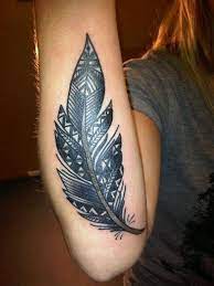 The symbol is often associated with ideas of freedom, courage, strength, and wisdom. Harsh Black Tribal Feather Tattoo On Arm Tattooimages Biz