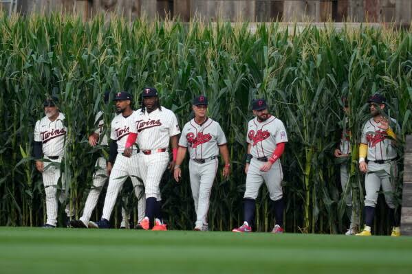 Field of Dreams game welcomes 26 Hall of Famers emerging from corn for Phillies-Twins matchup; Kyle Schwarber homers on third pitch