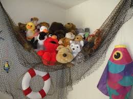 Fish Net You Can Pick Up At Any Hobby Lobby Turned Into A Stuffed Animal Holder For Baby S Room Our Theme Was Ah Fishing Room Toddler Rooms Fishing Bedroom