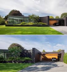 Nice entry to lower level from front of house. This Home Combines A Black Brick Exterior With Large Glass Walls For A Strong Contemporary Design