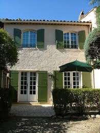 Our Garage Apt Styled After A Villa White Stucco With Brick Accents To Match The House And Dark Blue Shut Stucco House Colors House Color Schemes Stucco Homes