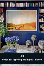 Here S How To Light Your Artwork Artwork Lighting Living Room Decor Modern Colorful Interiors