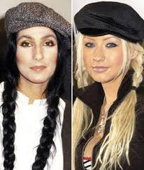 The voice coach, 35, worked her fiery tresses in old hollywood curls, deeply parted to one side. Burlesque Showdown Cher Vs Christina Aguilera