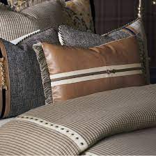 The faux leather upholstery in the middle with pure polyester in distinctive designs on two sides gives it a contemporary yet classy look to uplift any décor. Eastern Accents Edward Faux Leather Faux Leather Lumbar Pillow Wayfair