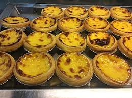 Photo about egg custard tart crisps dessert on dark wood background. Egg Tart Wikipedia