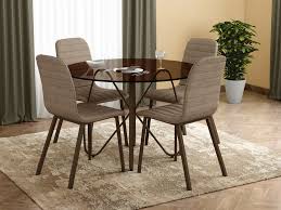 The 4 seater dining table is a staple furniture fixture in most indian households. Buy Godrej Salsa 4 Seater Dining Set Tinted Glass With Brown Colour Godrej Interio