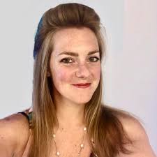 Southwest Museum archaeologist Anne Watkins holds an enormous obsidian  blade, found by the Wilder brothers (Karok Indians) after it was unearthed  by an earthquake in northern California, purchased by Gen. Charles Reeve