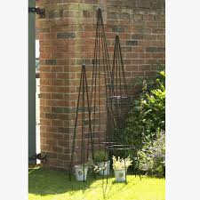 Many people choose traditional wrought iron trellises and arbors for their combination of strength and. Garden Plant Support Obelisk 6ft Made In Britain By The Orchard Notonthehighstreet Com