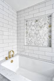 Large White Subway Tiles On A Bathtub Paired With Pewter Grout Complementing Hues On Hexagon Ac White Subway Tile Bathroom Marble Bathtub Bathtub Tile Surround