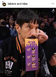 Flea with his son Darius Booker at a Los Angeles Lakers game 💜💛