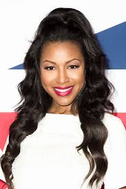 This wedding hairstyle for black women is perfect for a glamorous or romantic wedding aesthetic. Wedding Hairstyles For Black Women African American Wedding Haircuts