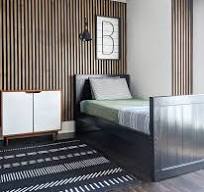 Boys room inspiration. Wooden slat wall with black bed, faux ...