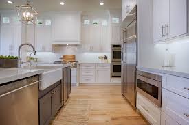 Koch cabinetry and hanstone quartz available to the quad cities from village home stores. White Shaker Cabinets Gray Island And Light Wood Floorings Create Such A Soft Inviting Atmosphere In The Ki Custom Kitchen Cabinets Kitchen Kitchen Cabinets