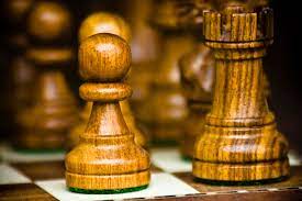 The chess rook in the opening. File Chess Pieces Pawn And Rook Jpg Wikimedia Commons