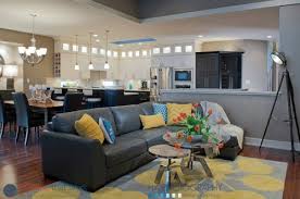 Aside from the comments above, i noticed that your artwork above the couch is too small for the scale of the wall or the furniture. Need A New Rug For Charcoal Couch