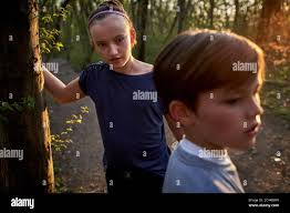 Brother and sister in the forest hi-res stock photography and images