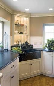 This large black granite island features a small undermount corner sink. 26 Farmhouse Kitchen Sink Ideas And Designs For 2021
