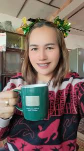 Mom happy with coffee in the mountains. We traveled to Nan province in  Thailand. We forgot how cold 11 degrees Celsius feels!!