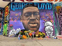 Malaysia hammond, 19, places flowers at a memorial mural for george floyd at the corner of chicago avenue and 38th street, sunday, may 31, 2020, in minneapolis. Artists Paint George Floyd Memorial On Riverwest Harambee Border Urban Milwaukee