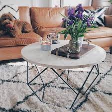 In photos it's a very sophisticated looking table, made from a metal frame which forms a series of pentagons and triangles, and a tiled top which resembles marble from afar but looks more like tile or maybe blocks of ivory up close. Origami Coffee Table Elm Coffee Table West Elm Coffee Table Coffee Table