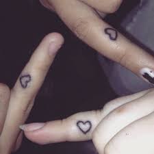 What should you know about the bff tattoos? Three Finger Matching Tattoos Of A Heart On Lexie And