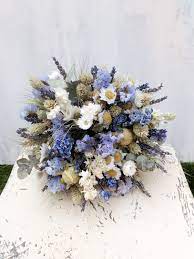 This dried wedding flower typically comes in neutral beige or muted pink shades, two essential hues of any boho color scheme. Dried Flower Bouquet Blues Wedding Flowers Bouquet Dried Flowers Hand Tied Bouquet Bridal Posy Rustic Florist Made Dried Flower Bouquet Flower Bouquet Wedding Blue Wedding Flowers Bouquet